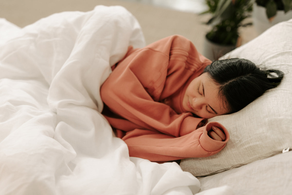 Person sleeping on a comfy bed