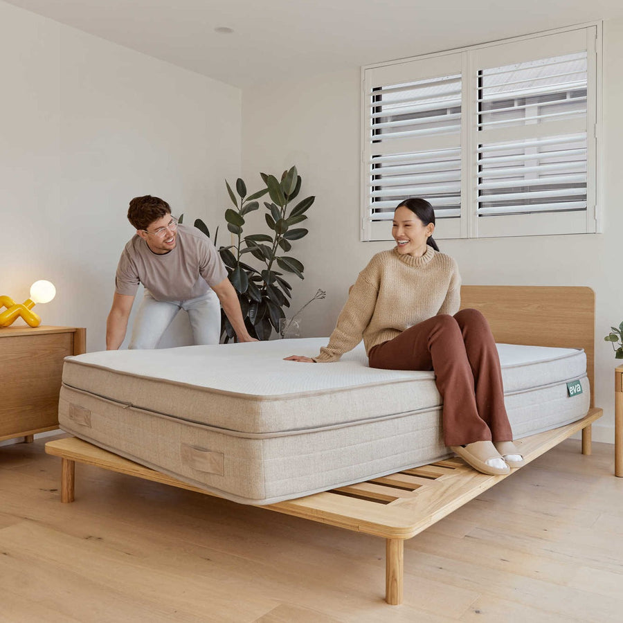 Couple placing Eva Mattress Plus on to Eva Timber Bed Frame | {"option1":["Premium Adapt Mattress"]}